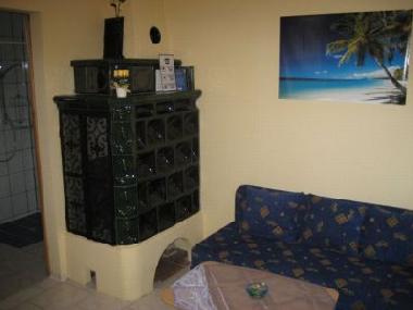 Wohnraum mit Kachelofen Ferienhaus