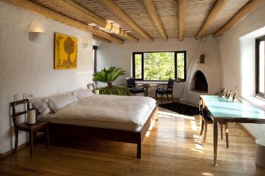 Mojanda Suite mit 2x2m Bett, Kamin, Sitzecke und herrlichem Blick auf die umliegenden Berge und den 