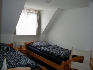 Ferienhaus Sierksdorf - das zweite Schlafzimmer im Obergeschoss mit zwei Einzelbetten
