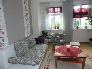 Wohnzimmer mit Doppelbettcouch