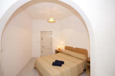 Large sleeping room with a tiny balcony to the country side