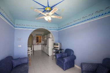 Living room/kitchen with entrance to the balcony