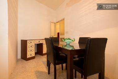 Table and chairs next to the third sleeping room