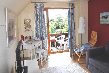 Wohnzimmer mit Zugang zur Terrasse