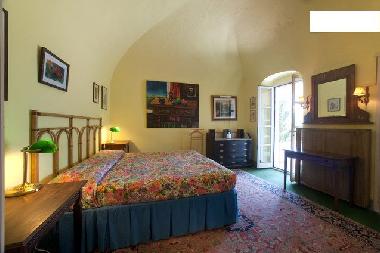 Schlafzimmer, Desk und french doors zu der Veranda