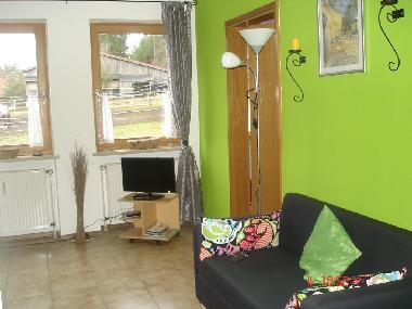 Wohnzimmer mit Blick auf den Paddock