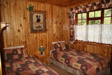 Sunbird Cottage Schlafzimmer mit 2 Einzelbetten