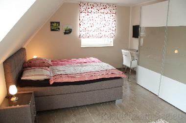 Schlafzimmer mit Balkon