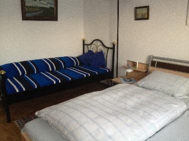 1 Schlafzimmer mit 3. Bett