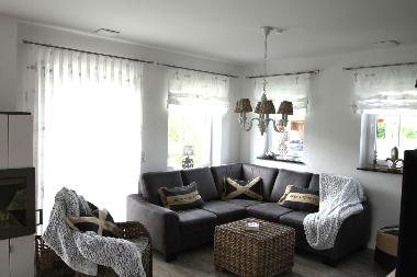 Wohnzimmer mit Kaminofen im Ferienhaus Deichkr�nchen